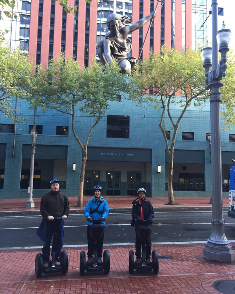 Chuck, Jess & Kronda on Segways in front of Portlandia Building
