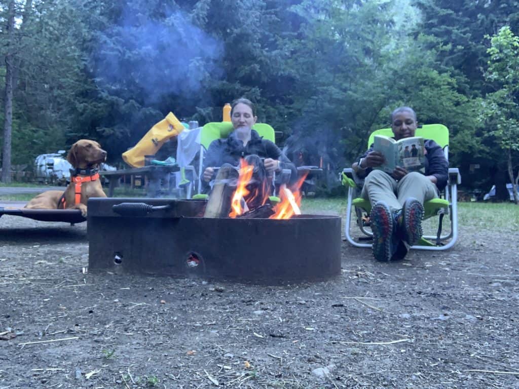 Kronda, Jess and Obi sitting around a campfire.